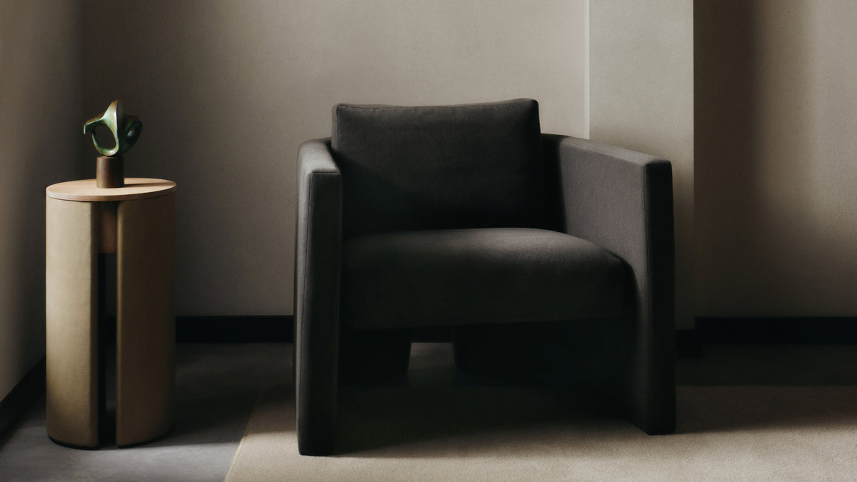 The Separa Chair in basalt marled alpaca velvet, styled beside the Vale Drink Table in cortado venetian leather.