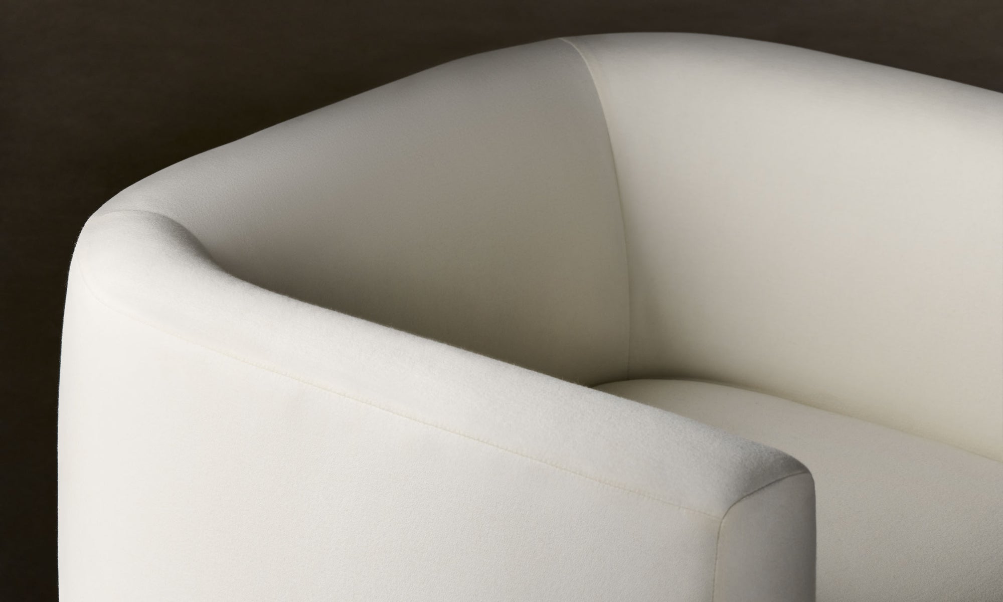 henri white wool swivel chair with wood accent, close up view
