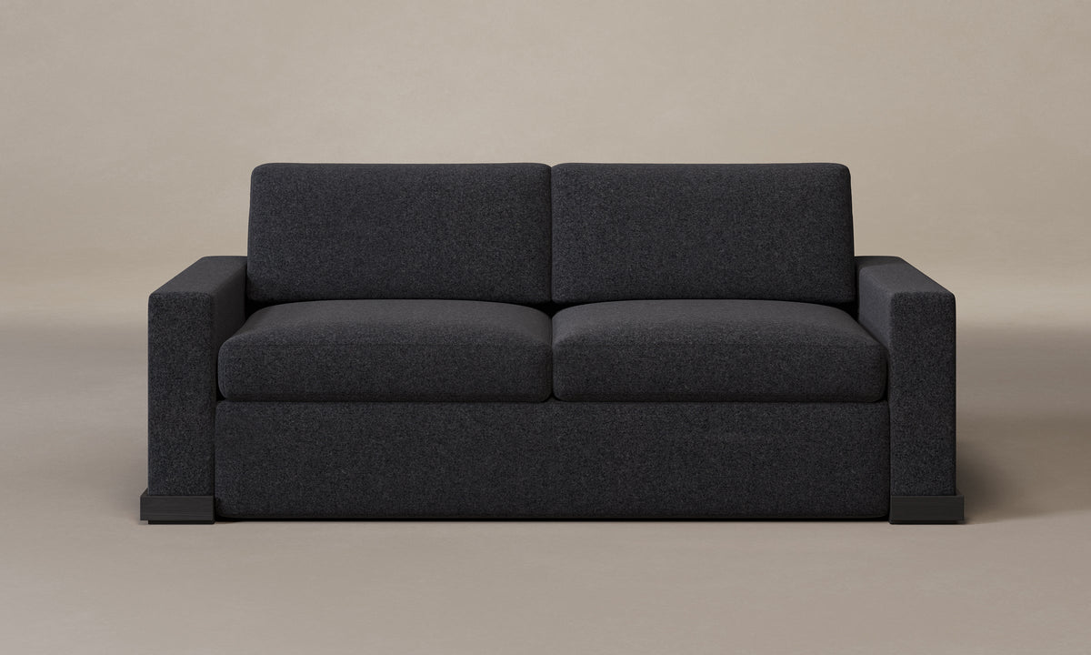 The Blair Sleeper Sofa in Italian Brushed Wool Pepper with Blackened Oak