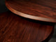 Extreme close-up of two Vestry Coffee Tables overlapping in rich mahogany grain with a lighter wood edge band.