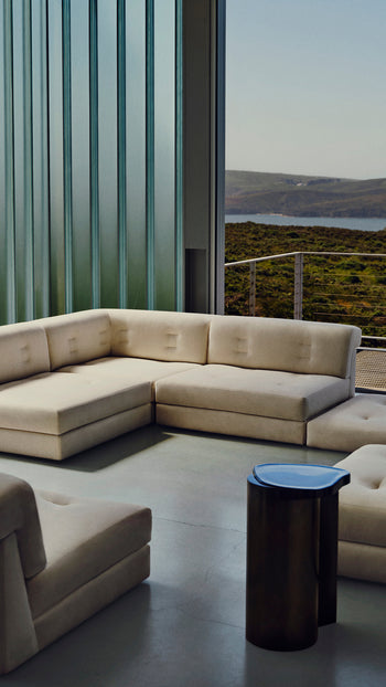 beige sofa in a modern living room with a view