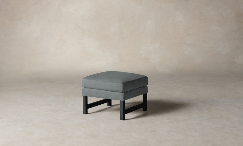 The Kaye Ottoman in Nubuck Leather Tide with Blackened
