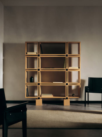 The Vento shelf in natural oak with the Leon Dining Chair in Obsidian Lacquer
