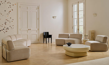 miles curved modular sectional in beige mohair and an art deco glass coffee table in a french living room