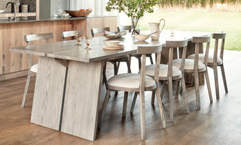 allen dining chair in grey ash wood and white leather seat in a modern dining room