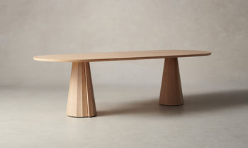 bank oval wood dining table in natural oak, angle view