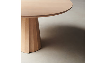 bank oval wood dining table in natural oak, close up