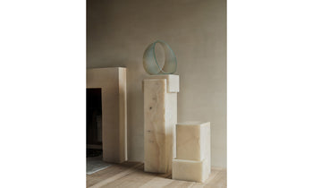 basel white onyx pedestals in a modern living room