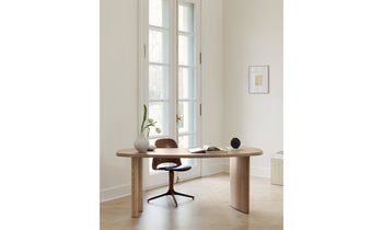 beekman wood desk in pecan oak with asymmetrical tabletop in an office