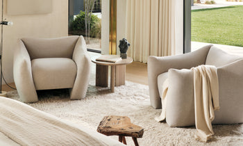 bond white linen accent chair with curved legs in a modern living room