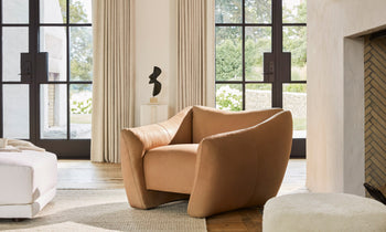 bond brown leather accent chair with curved legs in a modern living room