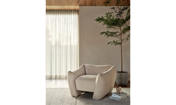 bond white leather accent chair with curved legs in a modern living room