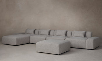 breuer modular chunky chaise sectional in grey linen with ottoman - angle view