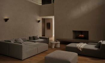 breuer modular chunky chaise sectional in grey linen with ottoman in a modern design living room