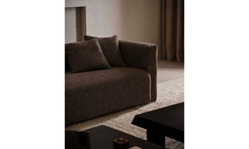 breuer sofa in brown linen with throw pillows in a modern living room