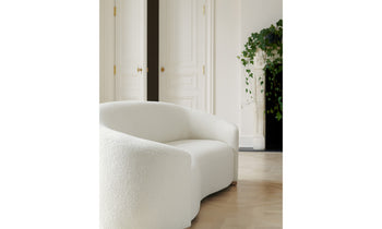 chelsea curved white boucle sofa in a modern living room