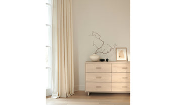 clinton white wood dresser with 6 drawers in whitewash ash in a modern bedroom setting