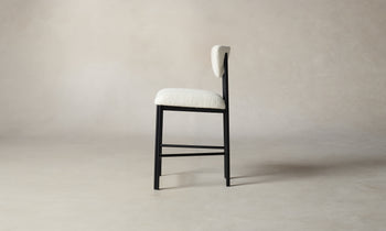 cooper counter stool in white boucle with black metal frame, side view