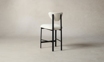 cooper counter stool in white boucle with black metal frame, back view