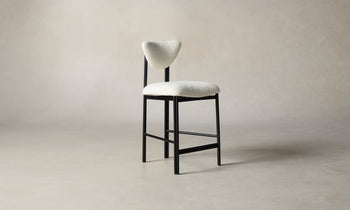 cooper counter stool in white boucle with black metal frame, angle view