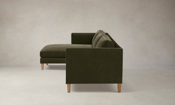 crosby olive green velvet sectional sofa with chaise with wooden legs - side view