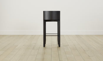 delancey barstool in black ash wood with truffle green leather seat with curved back, back view