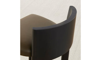 delancey barstool in black ash wood with truffle green leather seat with curved back, close up