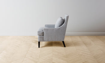 downing accent chair in grey linen with wooden legs and square seat - side view