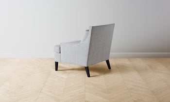 downing accent chair in grey linen with wooden legs and square seat - back view