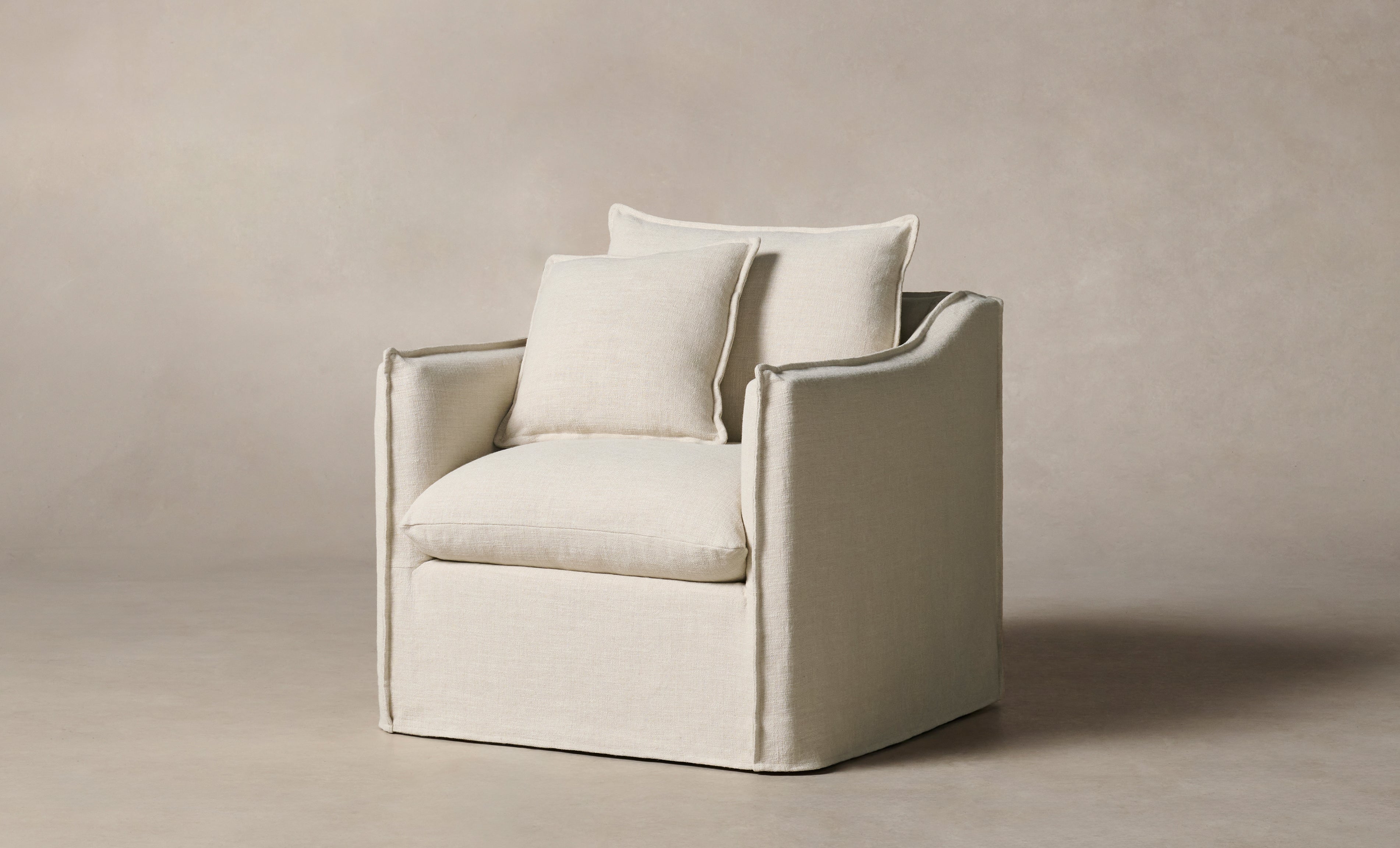 dune white linen upholstered accent chair with cushions - angle view