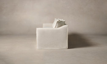 dune off-white linen sofa with cushions - side view