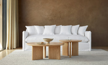 dune white linen sofa with cushions in a modern living room