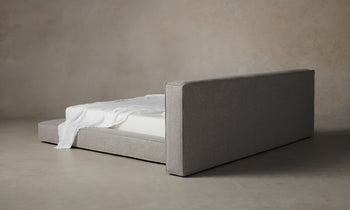 eldridge upholstered bed with cushion bed frame in grey linen - back view