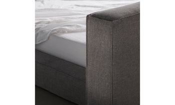 eldridge bed with upholstered headboard in gray linen - close up view