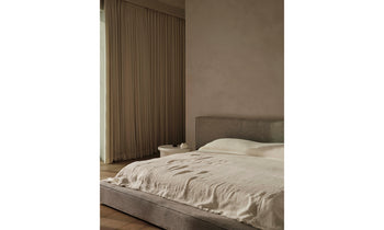 eldridge upholstered bed with cushion bed frame in grey linen in a modern bedroom