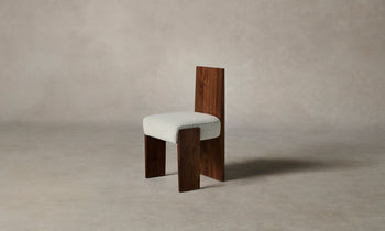 garrett dining chair in brown walnut wood and grey boucle fabric - angle view