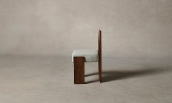 garrett dining chair in brown walnut wood and grey boucle fabric - side view