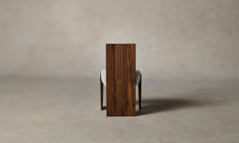 garrett dining chair in brown walnut wood and grey boucle fabric - back view