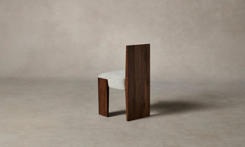 garrett dining chair in brown walnut wood and grey boucle fabric - side view