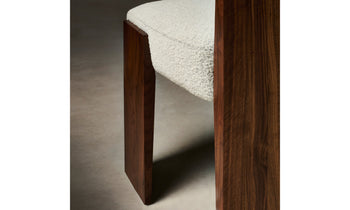 garrett dining chair in brown walnut wood and grey boucle fabric - close up view