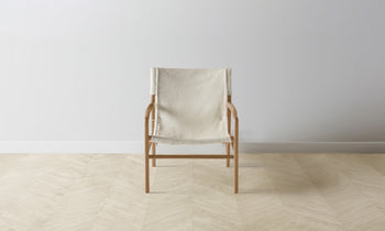 hayes sling accent chair in white pony hair leather and wooden frame - front view