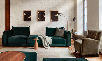 jones modular sofa in emerald green velvet with 3 seats in a modern living room