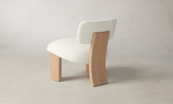 kenmare accent chair in white linen with ash wood curved frame and three legs - back view