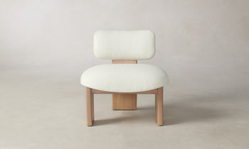 kenmare accent chair in white linen with ash wood frame and three legs - front view