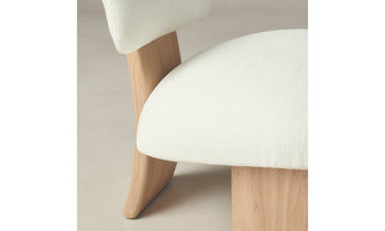 kenmare accent chair in white linen with ash wood curved frame and three legs - close up view