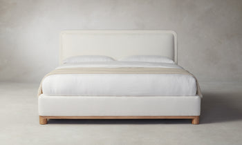 kent bed with upholstered frame and headboard in white linen with wood trim - front view