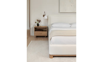 kent bed with upholstered frame and headboard in white linen with wood trim in a mid-century modern bedroom