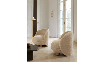 laight round beige shearling accent chair with wooden legs in a modern living room