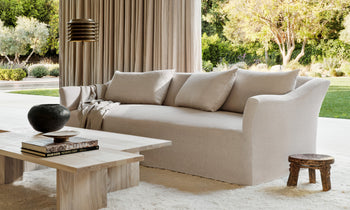 leonard sofa in beige linen with cushions in a modern living room