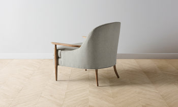 leroy mid-century modern accent chair in grey merino with wooden arms and legs - back view